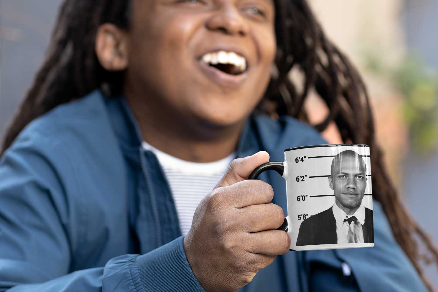 Man laughing with mugshot mug
